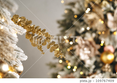 Golden Christmas baubles decoration close up .Holiday concept. 109767409