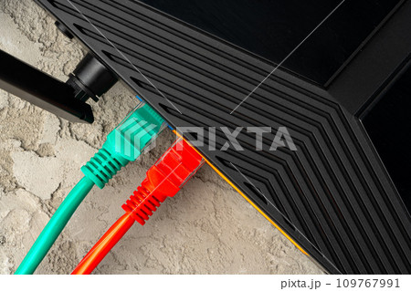 Colored network cable patch-cord on gray textured background 109767991