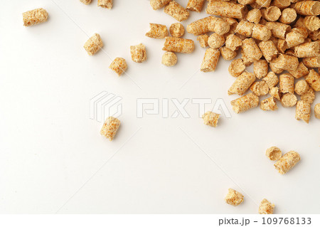 Wooden filler for cat litter box isolated on white background Wooden filler for cat litter box isolated on white background 109768133