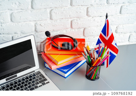 Laptop and flag of UK on desk. English language learning concept 109768192