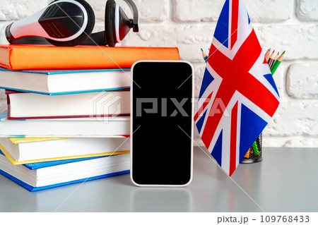 Headset and UK flag on working table 109768433