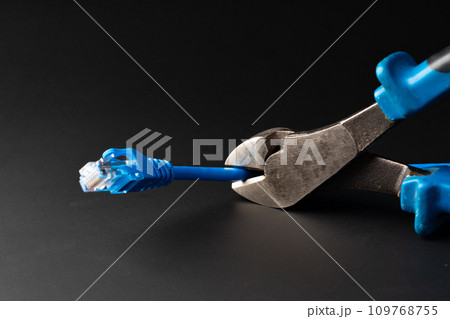 Cutting pliers cut electric cable close up Cutting pliers cut electric cable close up 109768755
