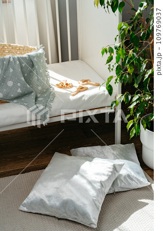 Nursery interior and bedding for kids with wicker bassinet Nursery interior and bedding for kids with wicker bassinet 109769037