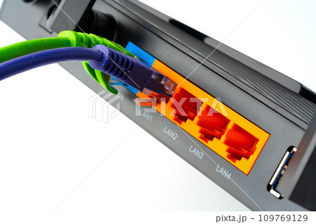 Modern router with cables plugged in close up 109769129
