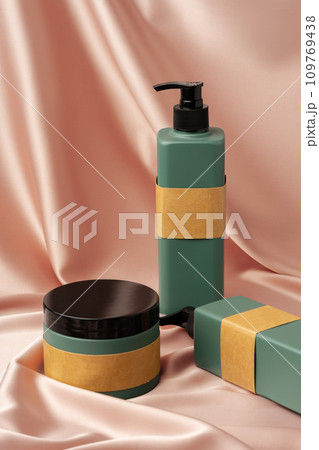 Cosmetic jar on nude satin fabric background 109769438