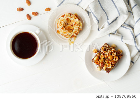 Almond tart and brownie on white background Almond tart and brownie on white background 109769860