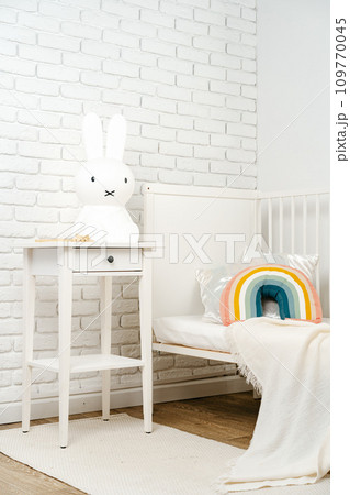 Kid's room interior with comfortable bed and rainbow pillow Kid's room interior with comfortable bed and rainbow pillow 109770045