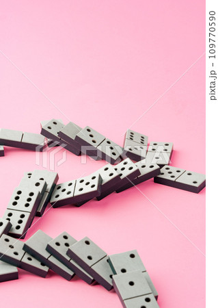 Domino tiles on pink background studio shot 109770590