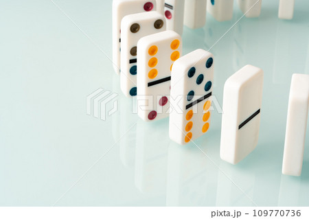 Domino tiles in a row on white background Domino tiles in a row on white background 109770736