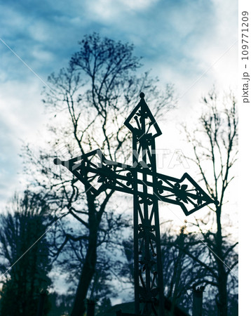Metal cross at cemetery. Religious graveyard. Death 109771209