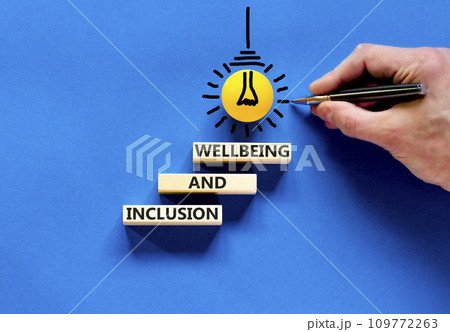 Inclusion and wellbeing symbol. Concept words Inclusion and wellbeing on wooden block. Beautiful blue table blue background. Doctor hand. Motivational inclusion and wellbeing concept. Copy space. Inclusion and wellbeing symbol. Concept words Inclusion and wellbeing on wooden block. Beautiful blue table blue background. Doctor hand. Motivational inclusion and wellbeing concept. Copy space. 109772263