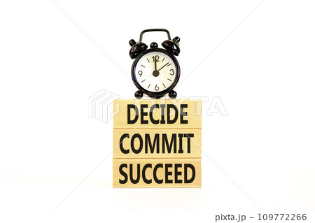 Decide commit succeed symbol. Concept word Decide Commit Succeed on beautiful wooden block. Black alarm clock. Beautiful white table background. Business decide commit succeed concept. Copy space. 109772266