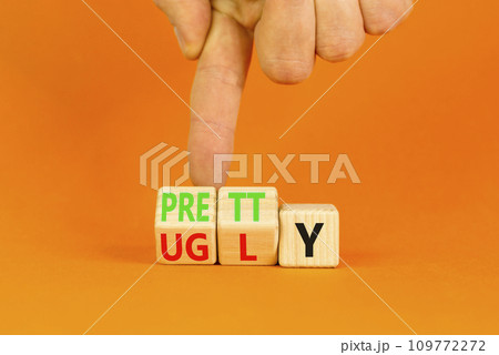 Pretty or ugly symbol. Concept word Pretty or Ugly on wooden cubes. Beautiful orange table orange background. Doctor hand. Business lifestyle and pretty or ugly concept. Copy space. Pretty or ugly symbol. Concept word Pretty or Ugly on wooden cubes. Beautiful orange table orange background. Doctor hand. Business lifestyle and pretty or ugly concept. Copy space. 109772272