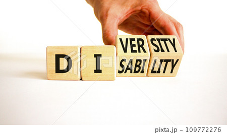 DEI Diversity or disability symbol. Concept words Diversity disability on wooden block. Beautiful white table white background. Businessman hand. Business diversity disability concept. Copy space. DEI Diversity or disability symbol. Concept words Diversity disability on wooden block. Beautiful white table white background. Businessman hand. Business diversity disability concept. Copy space. 109772276