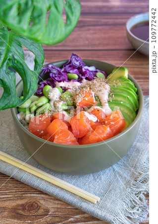 poke bowl with salmon on the wooden table 109772442