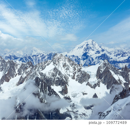 Mont Blanc mountain massif summer landscape (view from Aiguille du Midi Mount, France ) Mont Blanc mountain massif summer landscape (view from Aiguille du Midi Mount, France ) 109772489