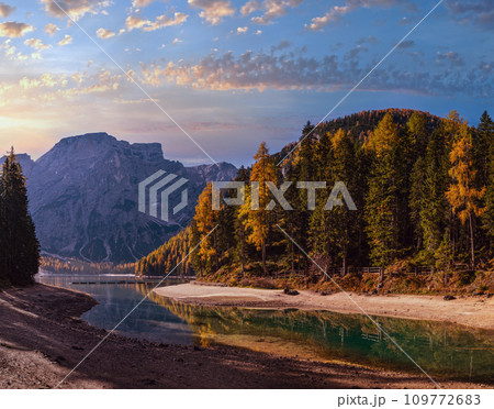 Autumn peaceful alpine lake Braies or Pragser Wildsee. Fanes-Sennes-Prags national park, South Tyrol, Dolomites Alps, Italy, Europe. Picturesque traveling, seasonal and nature beauty concept scene. Autumn peaceful alpine lake Braies or Pragser Wildsee. Fanes-Sennes-Prags national park, South Tyrol, Dolomites Alps, Italy, Europe. Picturesque traveling, seasonal and nature beauty concept scene. 109772683