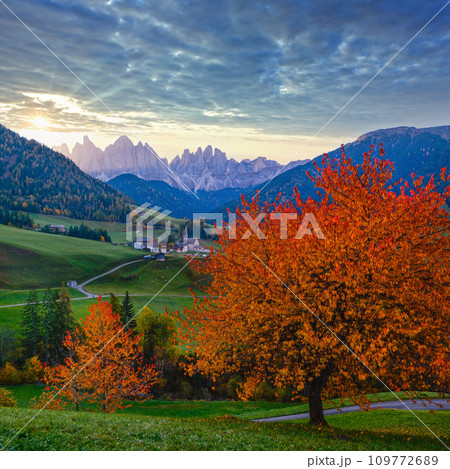 Autumn daybreak Santa Magdalena famous Italy Dolomites village view in front of the Geisler or Odle Dolomites mountain rocks. Picturesque traveling and countryside beauty concept background. 109772689