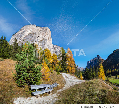Autumn alpine Dolomites mountain scene and unrecognizable paragliders in sky, Selva di Val Gardena, Sudtirol, Italy. Autumn alpine Dolomites mountain scene and unrecognizable paragliders in sky, Selva di Val Gardena, Sudtirol, Italy. 109772691