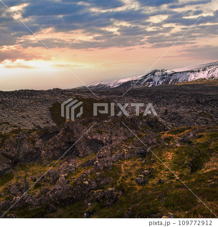 View during auto trip in West Iceland highlands, Snaefellsnes peninsula, Snaefellsjokull National Park, view from spectacular Djupalonssandur black volcanic beach with lava rocks. View during auto trip in West Iceland highlands, Snaefellsnes peninsula, Snaefellsjokull National Park, view from spectacular Djupalonssandur black volcanic beach with lava rocks. 109772912