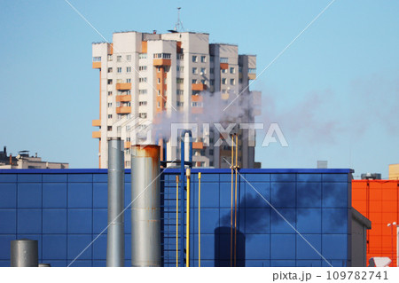 Roof of a house with a chimney in the cold season. Roof of a house with a chimney in the cold season. 109782741