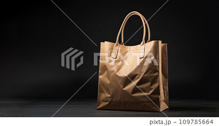 Natural paper shopping bag close-up on a black background, copy space. Black Friday, discounts, sale. 109785664