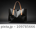 Black leather shopping bag close-up on a black background. Black Friday, discounts, sale. 109785666