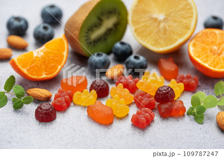 Chewable gummy vitamins and fruits 109787247