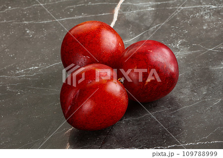 Ripe sweet juicy red plum Ripe sweet juicy red plum 109788999