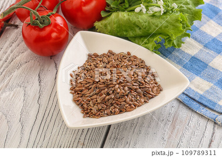 Dry Raw flax seed in the bowl Dry Raw flax seed in the bowl 109789311