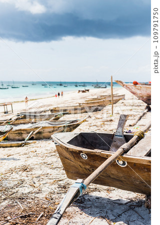 beautiful landscape with hammock hanging on palm and boats in ocean on the background beautiful landscape with hammock hanging on palm and boats in ocean on the background 109791750