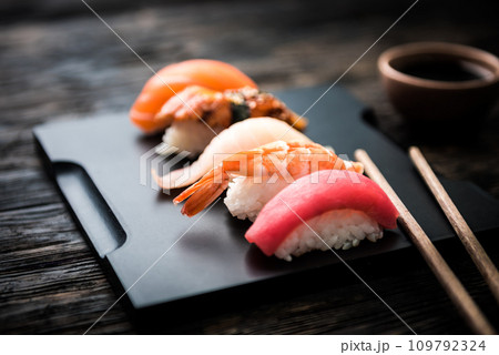 close up of sashimi sushi set with chopsticks and soy 109792324