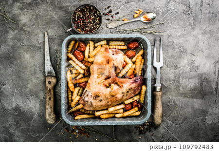 Fried turkey wing with fries in baking tray top view Fried turkey wing with fries in baking tray top view 109792483
