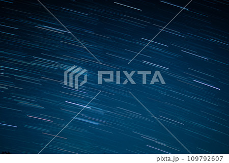 startrails on a dark blue sky 109792607
