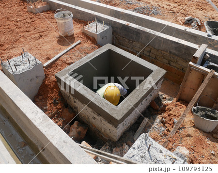 Melaka, Malaysia -February 2, 2022: Utility manhole under construction at a construction site. Built on site according to the engineer's design. Using plywood and timber as a construction mold 109793125