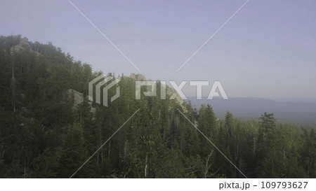 Mountain peaks view mountain forest trees. Mountainous terrain and forest in the fog. Beautiful forest and mountain 109793627