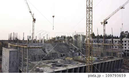 Top view see the construction site of Reinforced concrete high-rise Building. Clip. Top view of a building construction with tower cranes 109793659