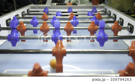 Table soccer. Foosball. Invisible playing table football. Unknown playing foosball. The table game players. The figures for the game of table football spinning Table soccer. Foosball. Invisible playing table football. Unknown playing foosball. The table game players. The figures for the game of table football spinning 109794263