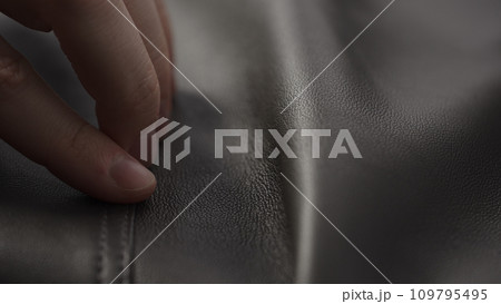 Closeup man touching fine leather 109795495