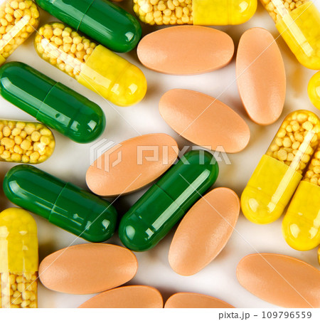 Medicines in capsules and tablets isolated on white. Medicines in capsules and tablets isolated on white. 109796559