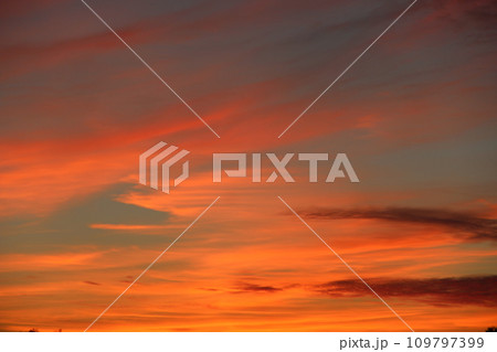 Orange sunset before night. Twilight with bright sunset. Evening landscape Orange sunset before night. Twilight with bright sunset. Evening landscape 109797399
