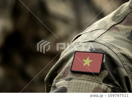 Flag of Vietnam on military uniform. Army, troops, soldiers. Collage. Flag of Vietnam on military uniform. Army, troops, soldiers. Collage. 109797511