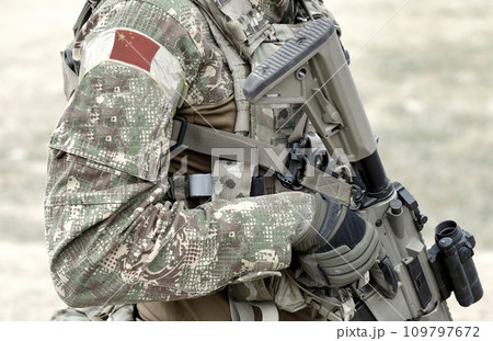 Soldier with assault rifle and flag of China on military uniform. Collage. Soldier with assault rifle and flag of China on military uniform. Collage. 109797672