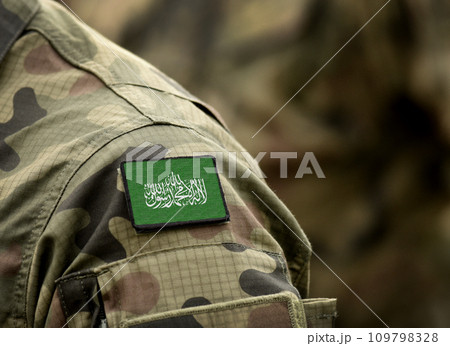 Flag of Hamas on military uniform (collage). 109798328