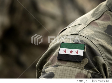 Flag of Syrian National Coalition on military uniform (collage). 109798548