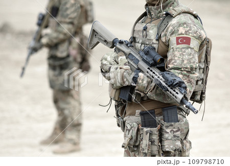 Soldiers with assault rifle and flag of Turkey on military uniform. Collage. 109798710