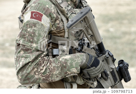 Soldier with assault rifle and flag of Turkey on military uniform. Collage. 109798713