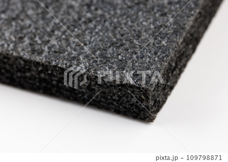 Black high-impact closed-cell polyethylene black foam sheet on white background. Specifically designed packing material. 109798871