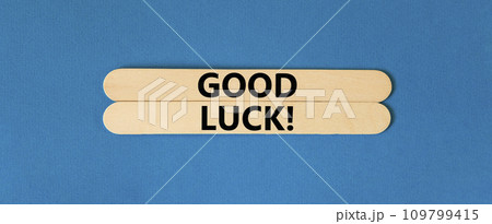 Good luck symbol. Concept words Good luck on wooden stick. Beautiful blue table blue background. Business, motivational good luck concept. Copy space. Good luck symbol. Concept words Good luck on wooden stick. Beautiful blue table blue background. Business, motivational good luck concept. Copy space. 109799415