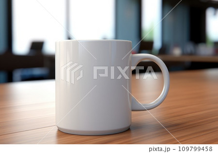 a white coffee mug is sitting on top of a table a white coffee mug is sitting on top of a table 109799458